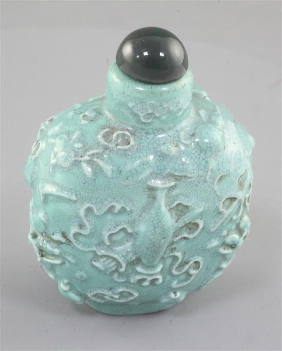 A Chinese turquoise glazed and moulded snuff bottle, 19th century, height 6.2cm